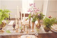 Tall candles, gold vases