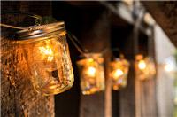 Decor & Event Styling. Lights in glass jars give a warm autumnal glow.